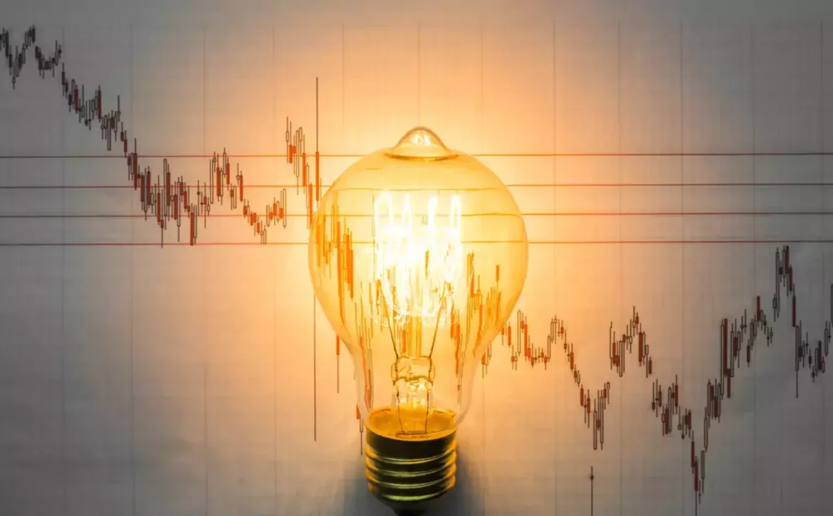 Light bulb with business graph